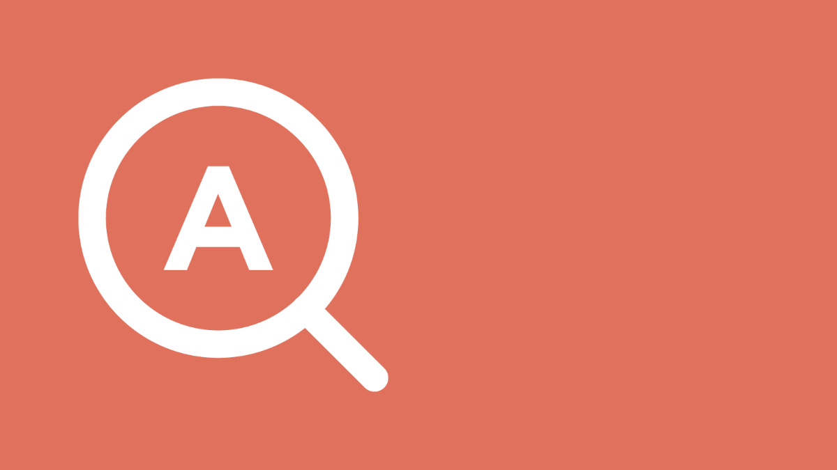 Kuvassa suurennuslasi, jonka keskellä kirjain A